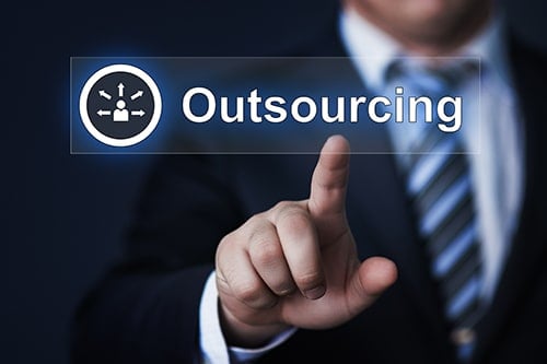 A finger pointing at a button.